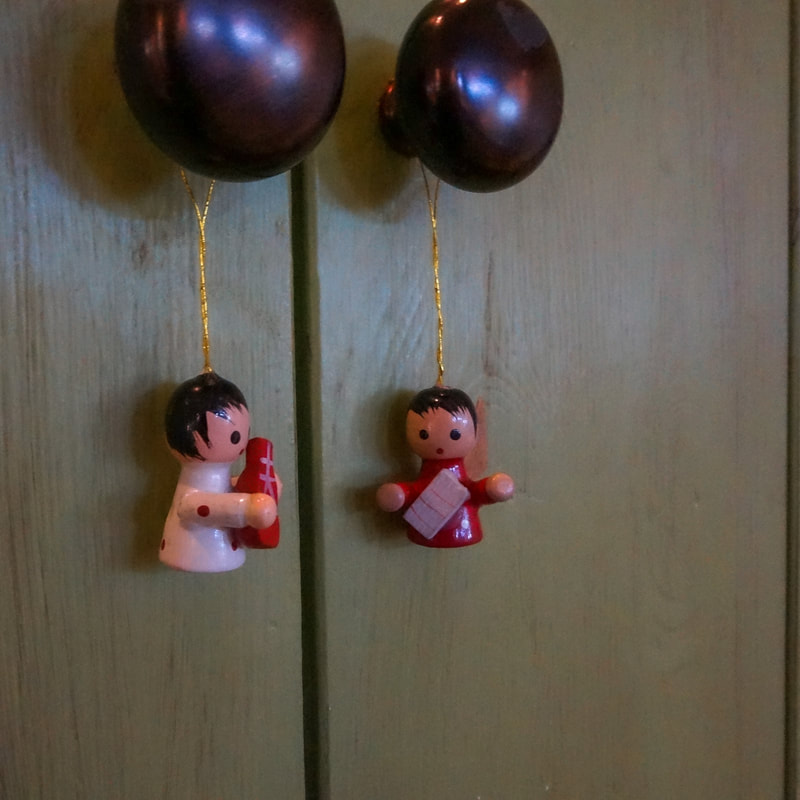tiny angles hanging on the door handles