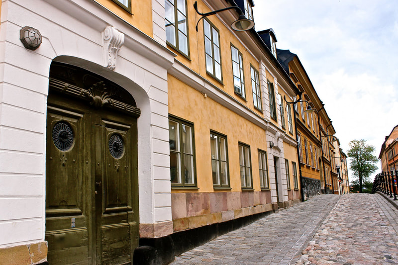 Very old building with a cobble stoned street in Stockholm