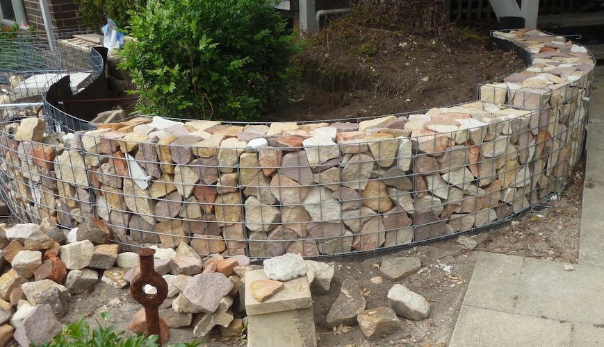 gorgeous curved gabion walls in a garden