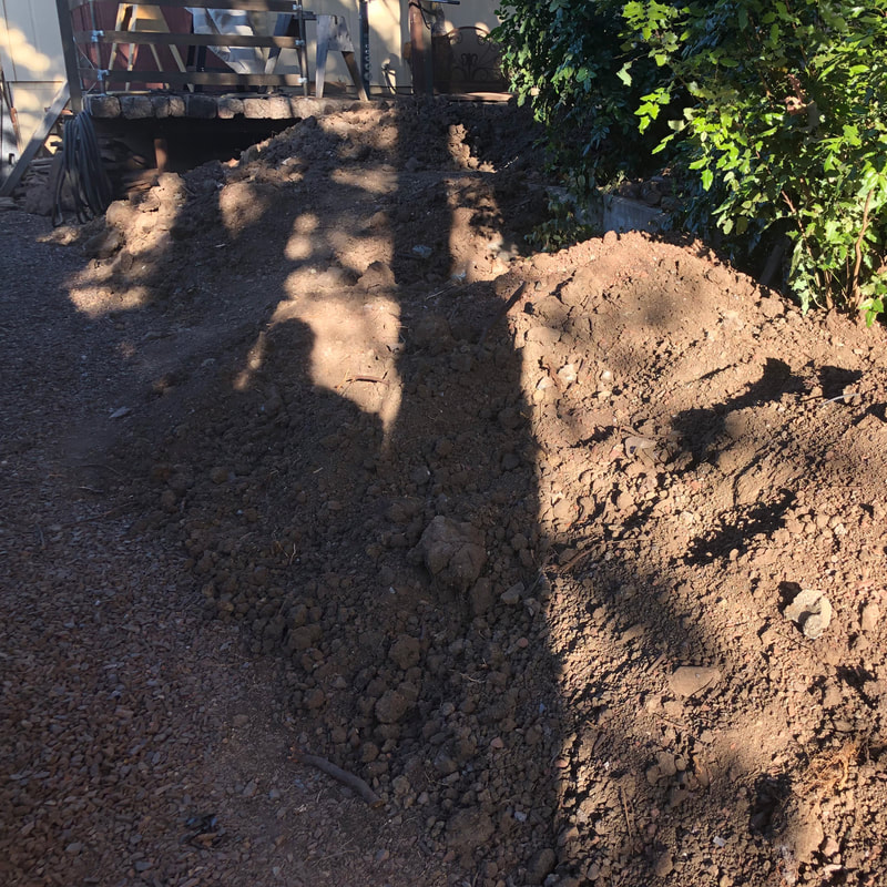 Huge pile of excavated soil in the back yard