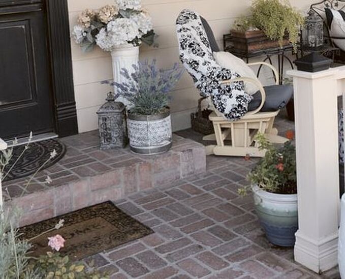 potted plants add color to the front stoop