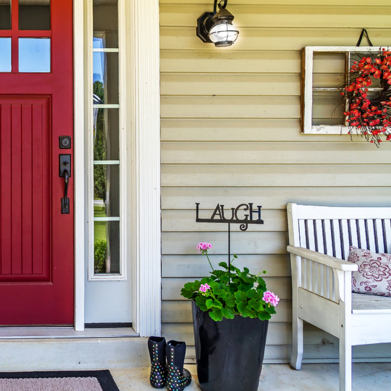 a simple front porch, with a red door