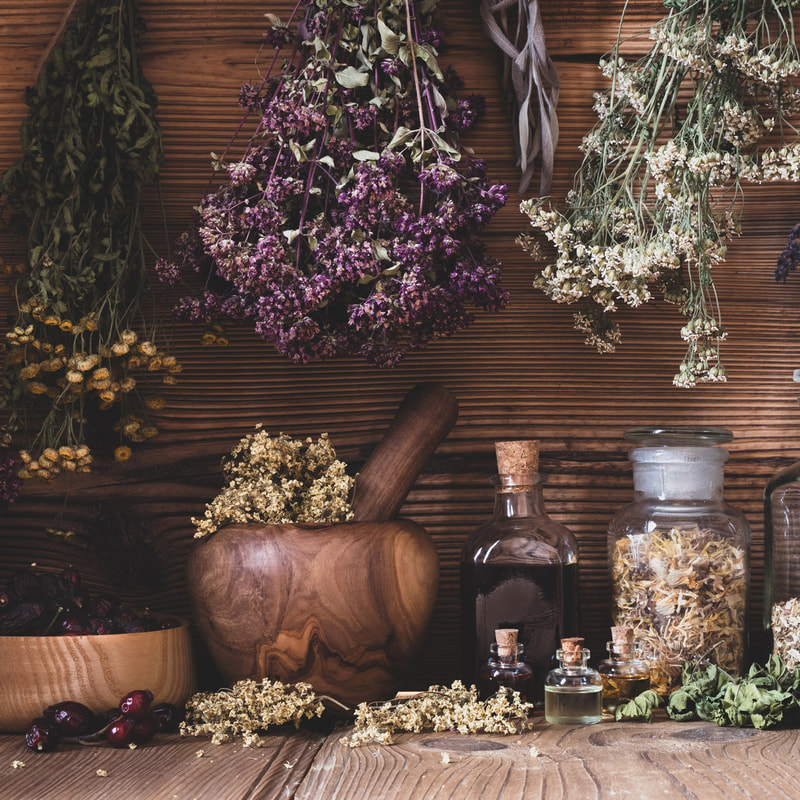 herbs drying in a wooden cabinet